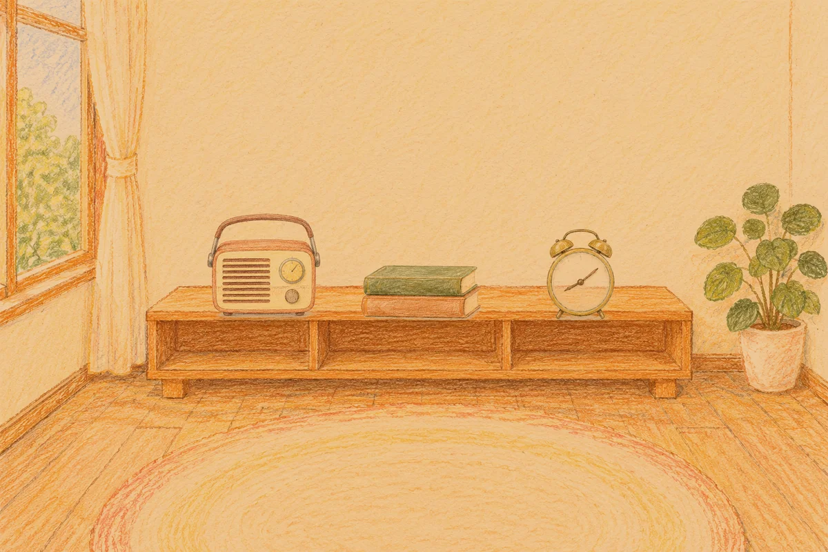 문정동 여성전용 경락 케어 안내 그림, 저녁의 창가 낮은 선반 위에 놓인 작은 라디오, 책 두 권, 둥근 알람시계
