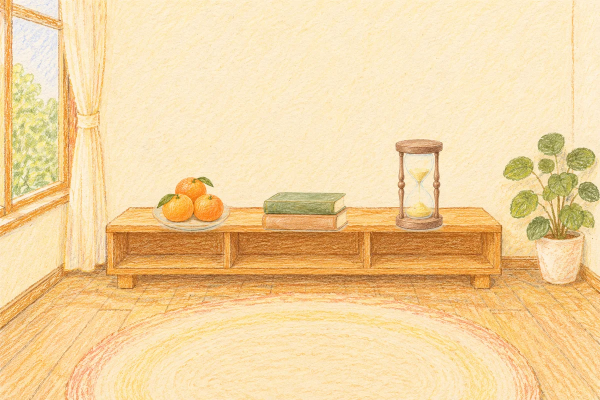 면목동 여성전용 등 마사지 안내 그림, 낮의 창가 낮은 선반 위에 놓인 귤이 담긴 접시, 책 두 권, 모래시계