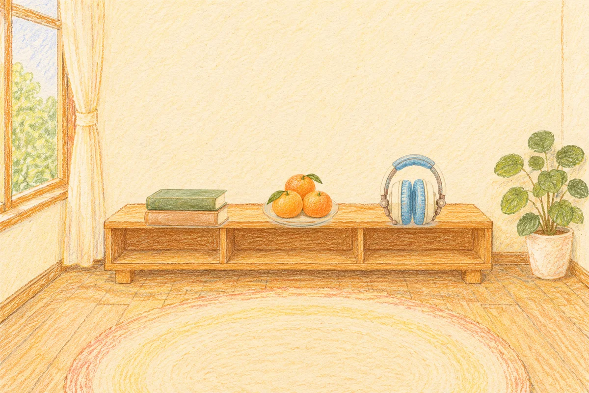 덕소 여성전용 발 케어 안내 그림, 낮의 창가 낮은 선반 위에 놓인 책 두 권, 귤이 담긴 접시, 헤드폰
